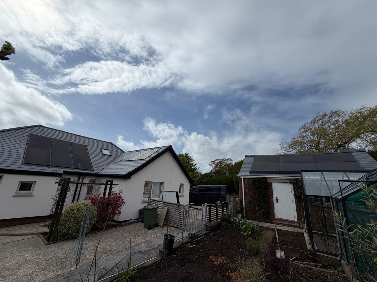 All black solar panels fitted to a pitched roof